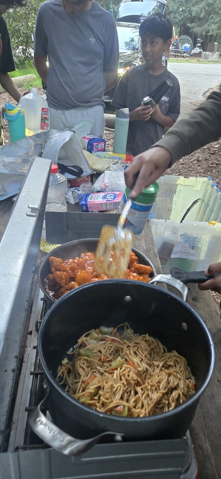 Patrol cooking noodles on a camp stove