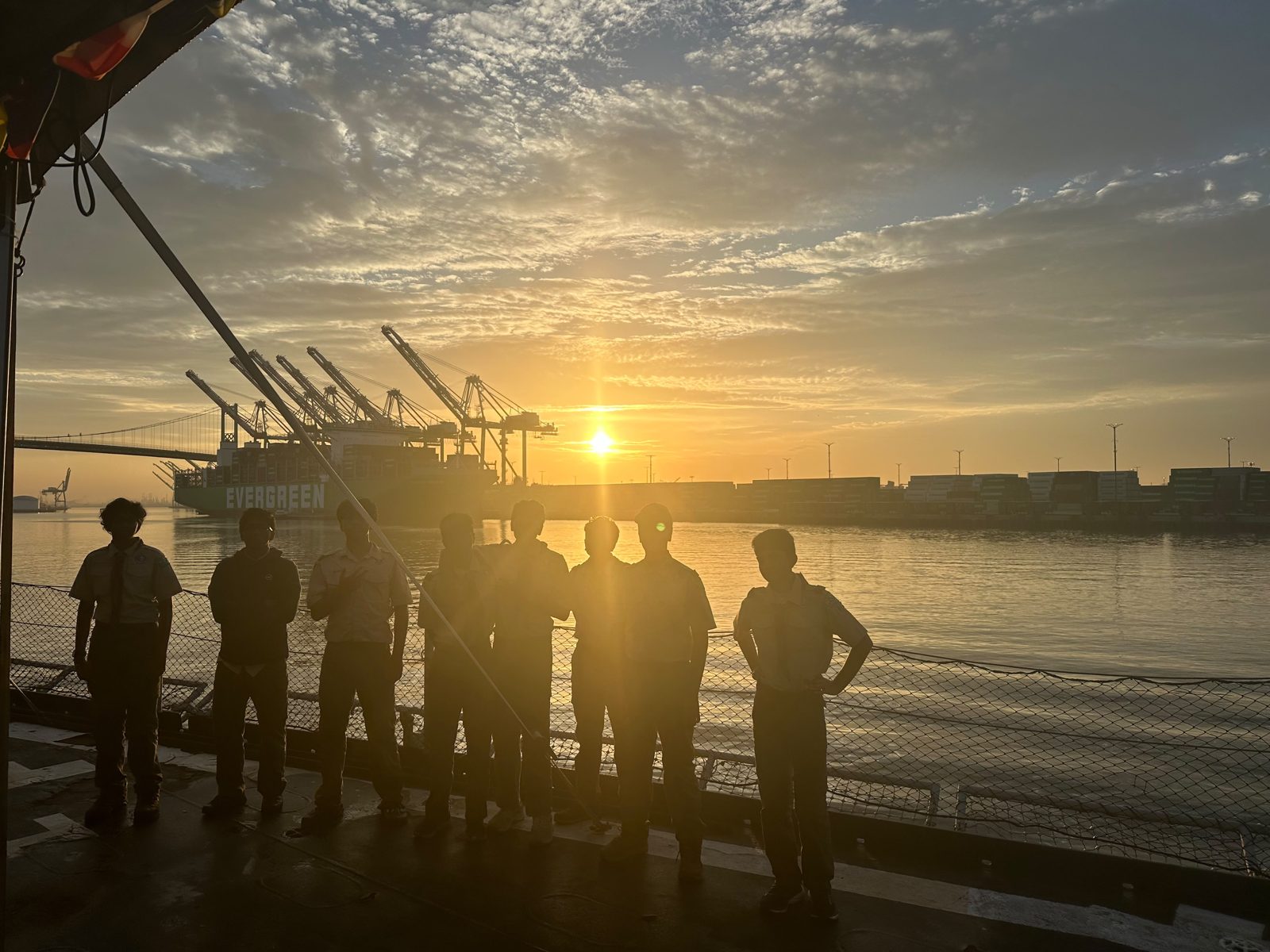 Scouts silhouetted against the sunrise over San Pedro harbor