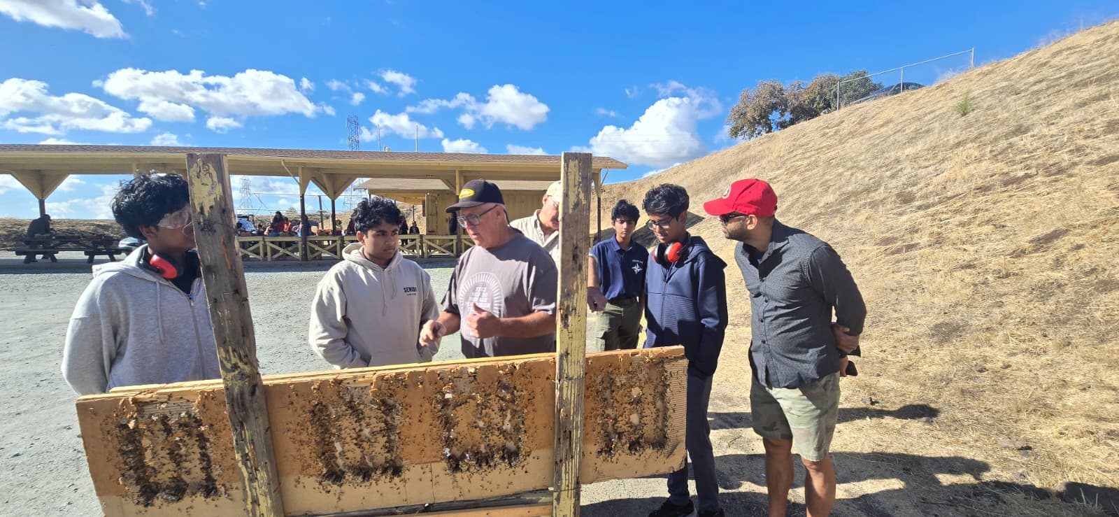 Troop 443 scouts and leaders at the shooting range